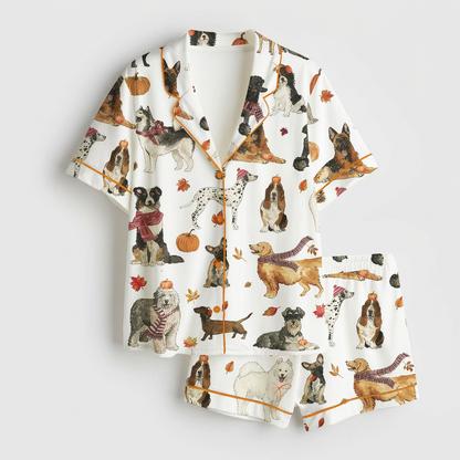 Women's satin pajama set with German shepherds, bassets, dalmatians and goldens with pumpkins and scarves on white - flat lay