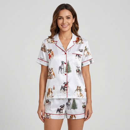 Women's satin pajama set with schnauzers, bulldogs and spaniels by evergreen trees, stockings and gift crates - short sleeve and shorts