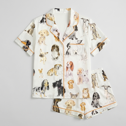 Women's satin pajama set with watercolor spaniels, terriers and whippets of many breeds on white - flat lay