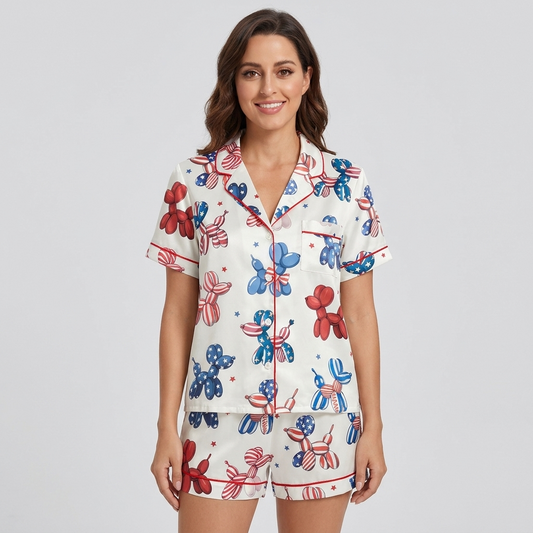 Women's satin pajama set with red, white and blue balloon dogs and confetti stars on white - short sleeve and shorts