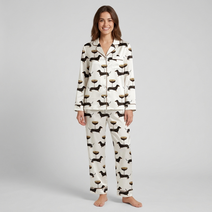 Women's satin pajama set with black dachshunds beside espresso martinis topped with coffee beans on white - long sleeve and pants