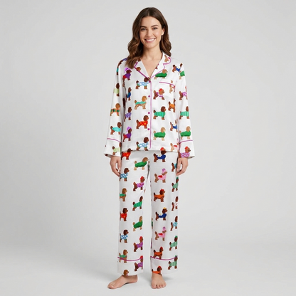 Women's long-sleeve satin pajama set with brown poodles in bright knit sweaters on white - long sleeve and pants