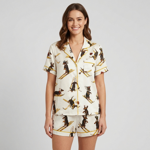 Women's satin pajama set with vintage dachshunds in knit caps skiing on golden skis on white - short sleeve and shorts