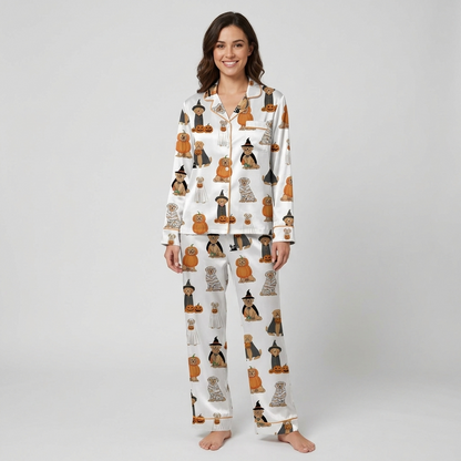 Women's satin pajama set with golden retrievers in witch hats, mummy wraps and ghost sheets on white - long sleeve and pants