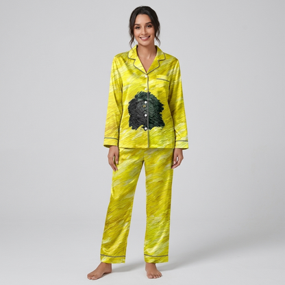 Women's satin pajama set with one shaggy black dog on a yellow painted field - long sleeve and pants
