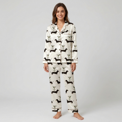 Women's satin pajama set with black dachshunds beside martini glasses tied with ribbon bows on white - long sleeve and pants