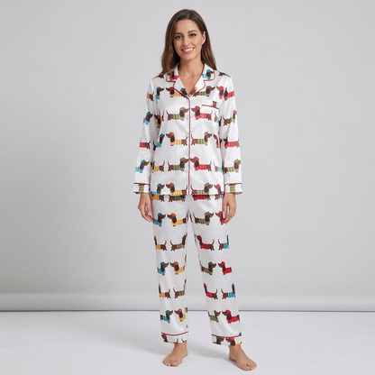 Women's satin pajama set with dachshunds in mustard, teal, green and red striped sweaters on white - long sleeve and pants