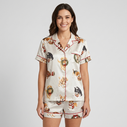 Women's satin pajama set with retrievers, beagles and terriers popping through holly wreaths on white - short sleeve and shorts