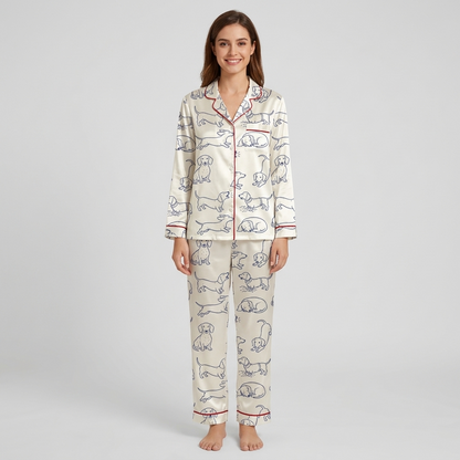 Women's satin pajama set with navy line-drawn dachshunds with red script on white - long sleeve and pants