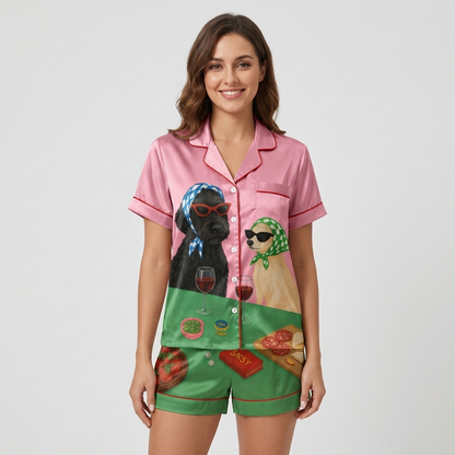 Women's satin pajama set with a black dog in cat-eye sunglasses and a golden dog in a scarf with wine on pink - short sleeve and shorts