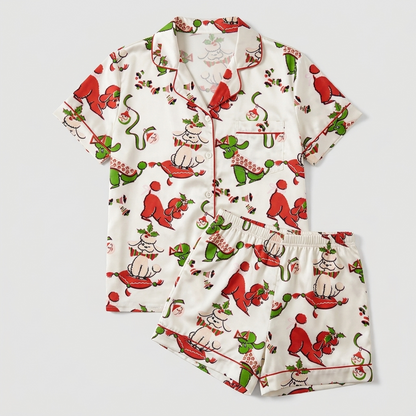 Women's satin pajama set with red and green poodles with holly and candy canes on white - flat lay