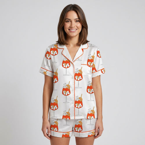 Women's satin pajama set with dachshunds tucked into orange spritz glasses on crisp white - short sleeve and shorts