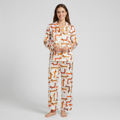Women's satin pajama set with rows of rust, caramel and toffee dachshunds on crisp white - long sleeve and pants