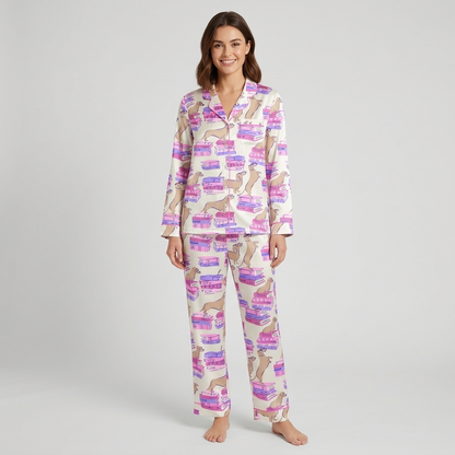 Women's satin pajama set with tan dachshunds sprawled on stacks of pink and purple books on white - long sleeve and pants