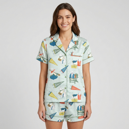 Women's satin pajama set with dogs in Adirondack chairs and canoes with fishing flags on mint green - short sleeve and shorts