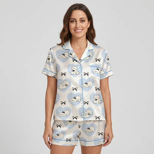 Women's satin pajama set with sleepy white fluffy dogs in sky-blue hearts on white - short sleeve and shorts