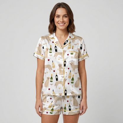 Women's satin pajama set with cream golden retrievers, wine bottles and goblets on white with gold piping - short sleeve and shorts