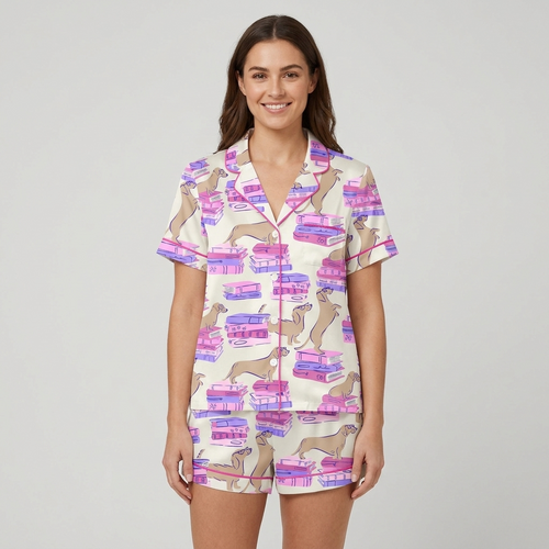 Women's satin pajama set with tan dachshunds sprawled on stacks of pink and purple books on white - short sleeve and shorts