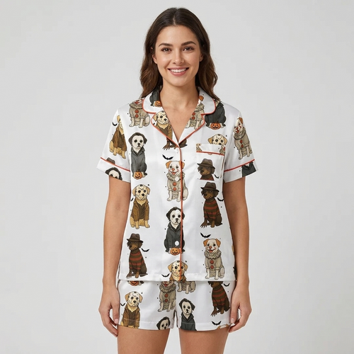 Women's satin pajama set with dogs in Halloween masks, hoods and hats beside jack-o'-lanterns on white - short sleeve and shorts