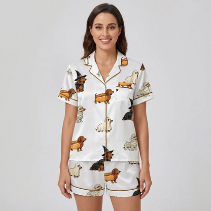 Women's satin pajama set with dachshunds dressed as witches, ghosts and mummies on white - short sleeve and shorts