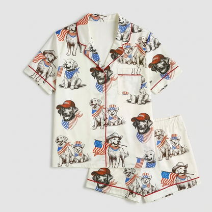 Women's satin pajama set with golden retrievers in cowboy hats with tiny American flags on white - flat lay