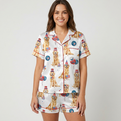 Women's satin pajama set with golden retrievers in star top hats and heart sunglasses among flags and balloons - short sleeve and shorts