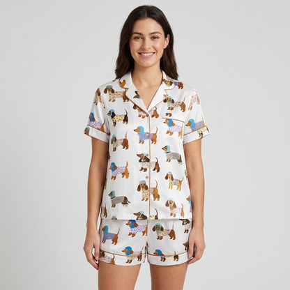 Women's long-sleeve satin pajama set with dachshund pups in flowered knits and blue bonnets on white - short sleeve and shorts