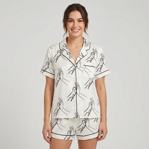 Women's satin pajama set with line-art hand and dog paw high fives on white - short sleeve and shorts