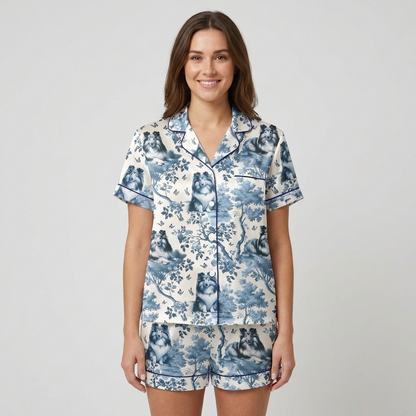 Women's satin pajama set with Shetland sheepdogs among blue-and-white toile trees and butterflies - short sleeve and shorts