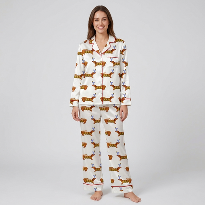 Women's satin pajama set with russet dachshunds balancing blue cocktail glasses in rows on white - long sleeve and pants