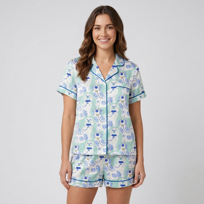 Women's satin pajama set with blue and white porcelain spaniel figurines in lattice frames on mint green - short sleeve and shorts