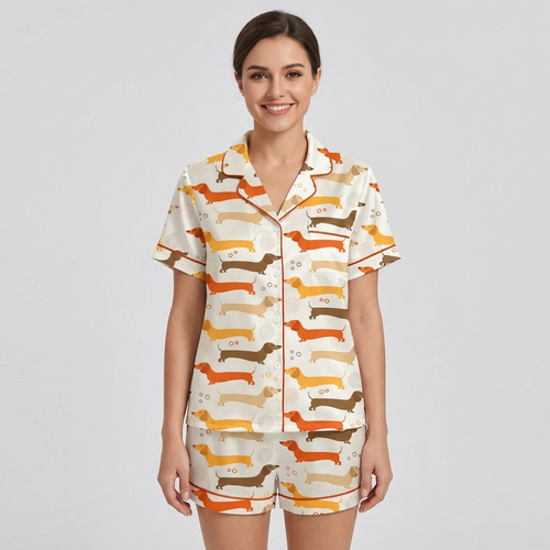 Women's satin pajama set with rows of tangerine, caramel and golden yellow dachshunds on white - short sleeve and shorts