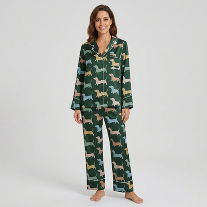 Women's satin pajama set with tan, sky blue and blush dachshunds on deep forest green with white piping - long sleeve and pants