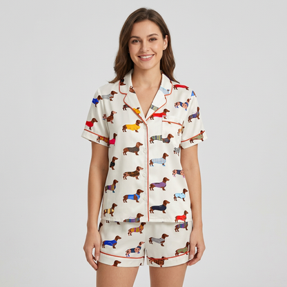 Women's satin pajama set with dachshunds in plaid, check and tartan coats on white with red piping - short sleeve and shorts