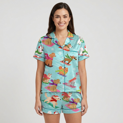 Women's satin pajama set with poodles, retrievers and spaniels sledding in Santa hats on aqua slopes - short sleeve and shorts