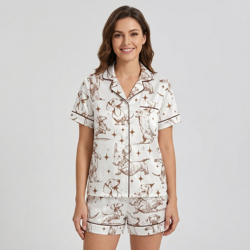 Women's long-sleeve satin pajama set with dachshunds among stars and crescent moons in brown line art on white - short sleeve and shorts