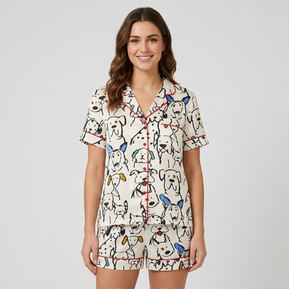 Women's long-sleeve satin pajama set with dalmatians and line-drawn dogs in black ink on white - short sleeve and shorts