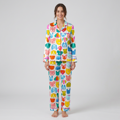 Women's satin pajama set with cartoon dog faces in hot pink, yellow, turquoise, orange and lime on white - long sleeve and pants