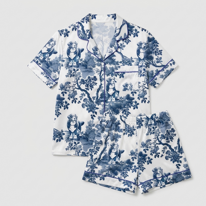 Women's satin pajama set with Bernese mountain dogs in a navy blossom toile on white - flat lay