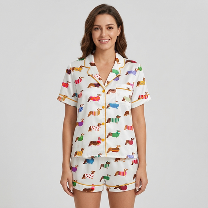 Women's satin pajama set with corgis in polka dot, striped and heart-print sweaters on white - short sleeve and shorts