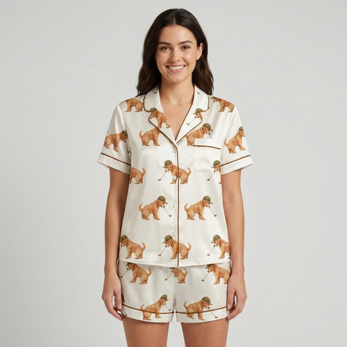 Women's satin pajama set with golden retriever puppies in tweed flat caps swinging golf clubs on white - short sleeve and shorts