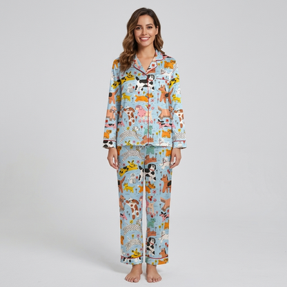 Women's satin pajama set with wobbly colorful dogs among flowers and bones on sky blue - long sleeve and pants