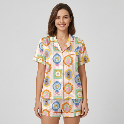 Women's satin pajama set with corgis and poodles in ornate frames on candy-striped blush pink - short sleeve and shorts