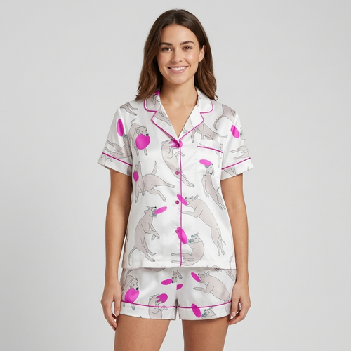 Women's satin pajama set with long-limbed gray dogs leaping for hot pink flying discs on white - short sleeve and shorts