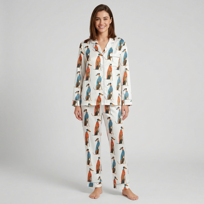 Women's satin pajama set with seated greyhounds in blue and orange patterned coats on white - long sleeve and pants