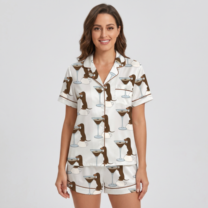 Women's satin pajama set with basset hounds leaning into espresso martini glasses on white - short sleeve and shorts