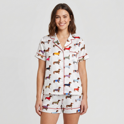 Women's long-sleeve satin pajama set with rows of dachshunds in rainbow tartan and striped sweaters on white - short sleeve and shorts