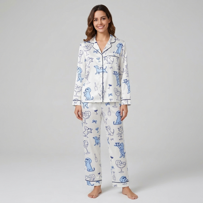 Women's satin pajama set with blue dachshunds in sunglasses toasting with martinis and champagne on white - long sleeve and pants