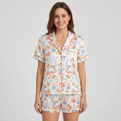 Women's satin pajama set with white pups in sunglasses with crabs, pineapples and palm trees - short sleeve and shorts