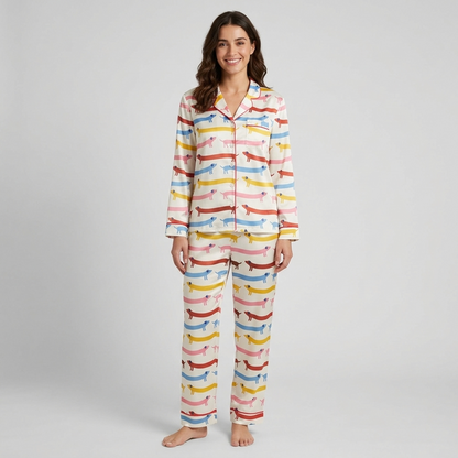 Women's satin pajama set with dachshunds in coral, yellow, sky blue and pink stripes on creamy white with pink piping - long sleeve and pants